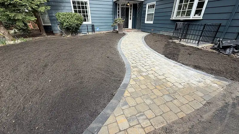 Tumbled cobblestone paver walkway with charcoal border installed at an Eastmoreland Portland Oregon home